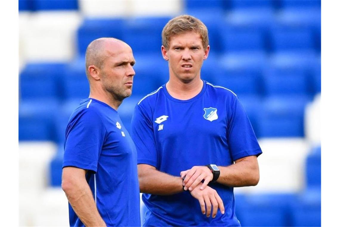 Alfred Schreuder und Julian Nagelsmann (l-r). Foto: Uwe Anspach/Archivbild