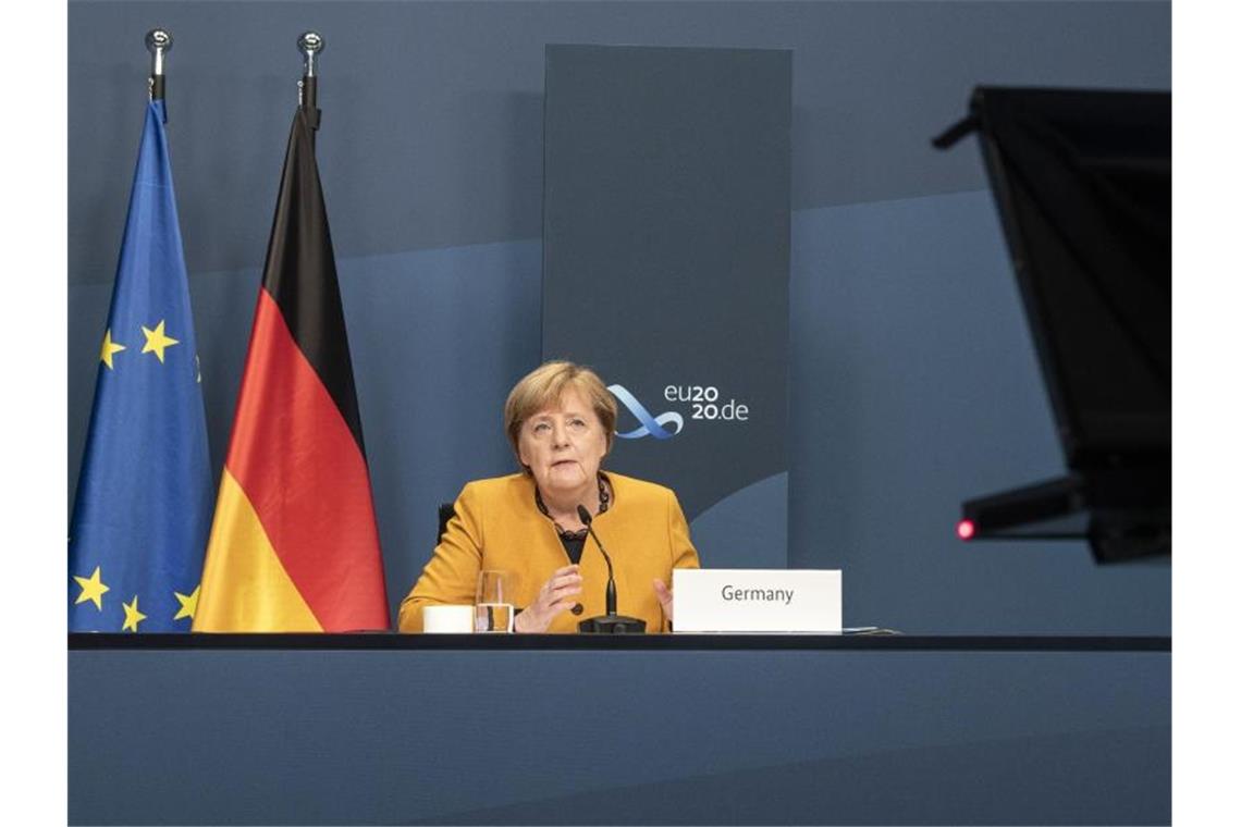 Angela Merkel, Bundeskanzlerin, nimmt im Rahmen des beim virtuellen G20-Gipfel an einer Videokonferenz im Kanzleramt teil. Foto: Guido Bergmann/Bundesregierung/dpa