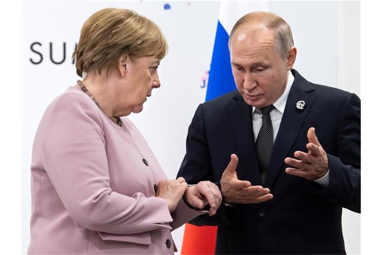 Angela Merkel und Wladimir Putin am Rande des G20-Gipfels in Osaka. Foto: Bernd von Jutrczenka/dpa