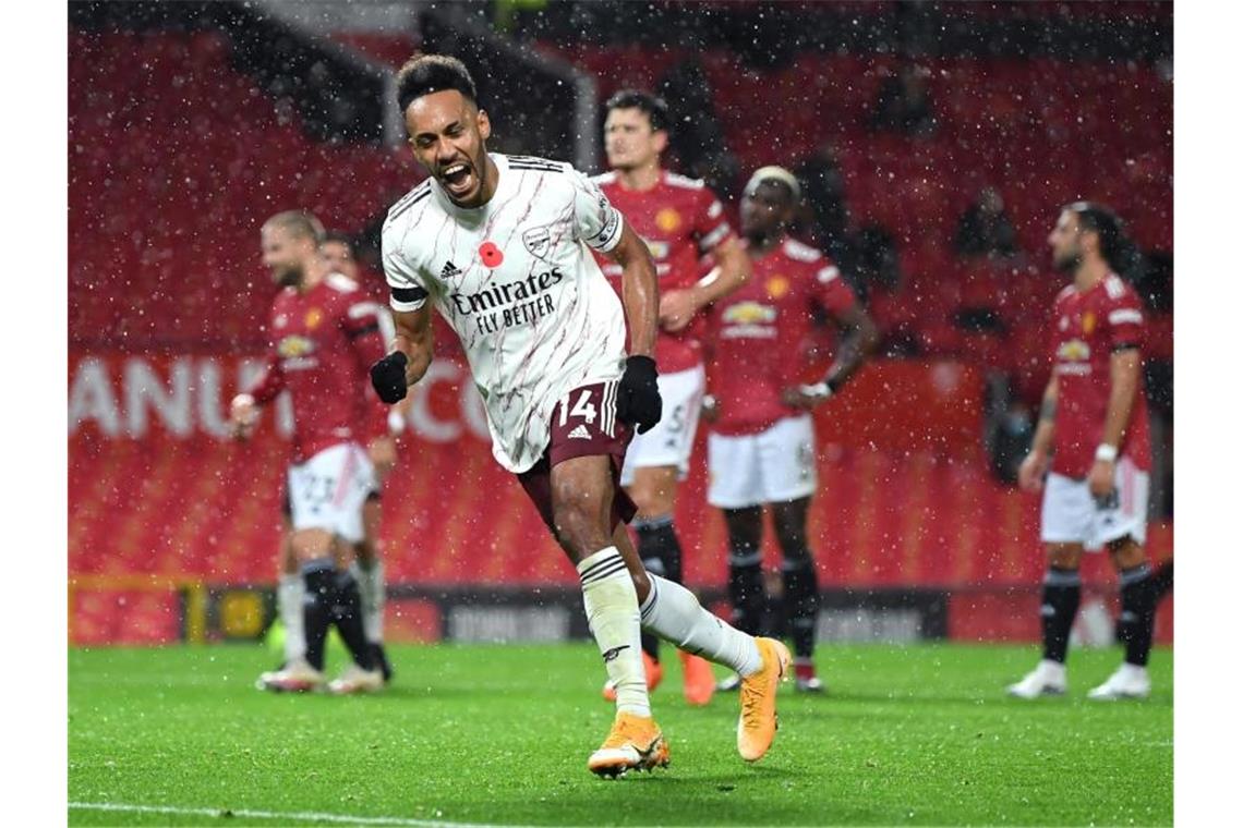 Klopp stellt mit Liverpool Rekord ein Arsenals Pierre-Emerick Aubameyang feiert sein Tor zum 0:1 bei Manchester United. Foto: Shaun Botterill/PA Wire/dpa