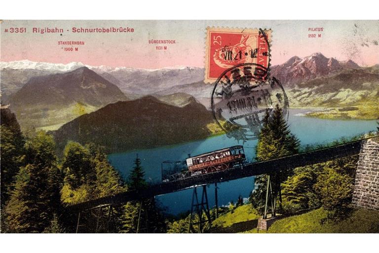 Auf dieser Postkarte von 1935 ist die  Rigibahn zu sehen, wie sie  Schnurtobelbrücke überquert. Im Hintergrund ist der Vierwaldstättersee bei Luzern zu sehen.