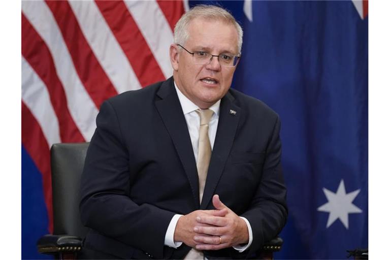 Australiens Premierminister Scott Morrison ist noch unschlüssig, ob er zum UN-Klimagipfel fährt. Foto: Evan Vucci/AP/dpa/Archivbild