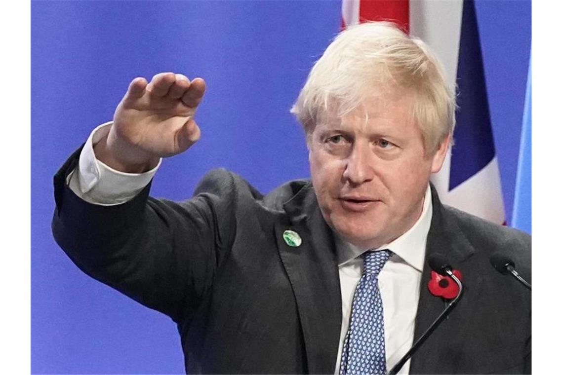 Massenproteste erhöhen Druck auf die Weltklimakonferenz Boris Johnson fordert die Teilnehmer des Klimagipfels auf, an einem Strang zu ziehen. Foto: Stefan Rousseau/PA Wire/dpa