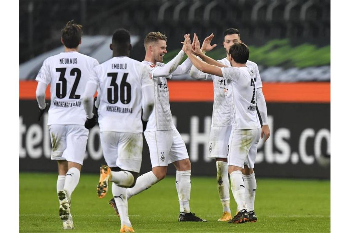 Klassiker zum Vergessen für die Bayern - Gladbach ganz stark Borussia Mönchengladbach drehte das Spiel und jubelte am Ende gegen den FC Bayern München. Foto: Martin Meissner/AP/Pool/dpa