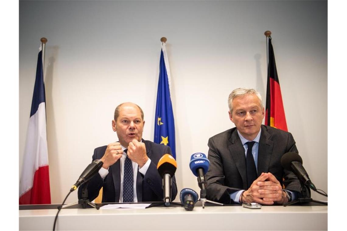 Fortschritte beim umstrittenen Eurozonenbudget Bundesfinanzminister Olaf Scholz und der französische Wirtschaftsminister Bruno Le Maire während einer gemeinsamen Pressekonfenerz. Foto: Arne Immanuel Bänsch