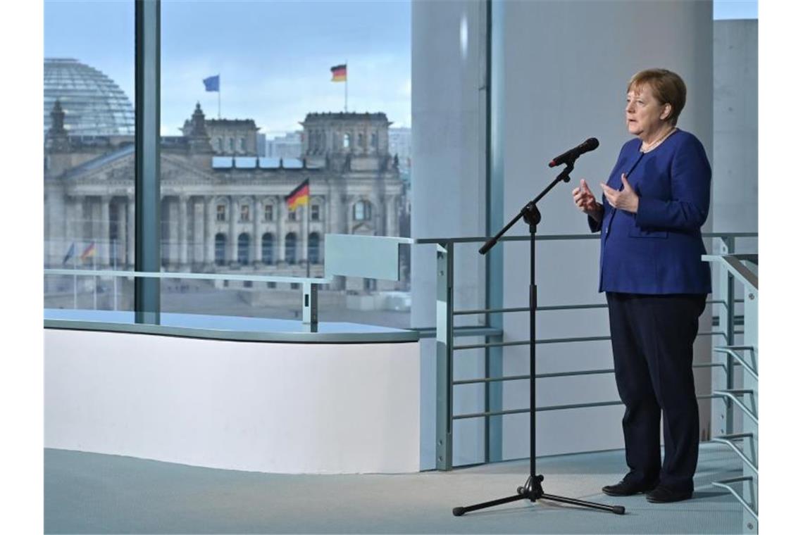 Bundeskanzlerin Angela Merkel äußert sich in Berlin zu den Folgen und Herausforderungen aufgrund des Coronavirus. Foto: John Macdougall/POOl AFP/dpa