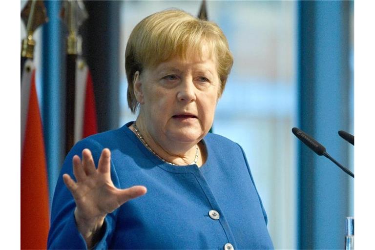 Bundeskanzlerin Angela Merkel (CDU) spricht auf der Investorenkonferenz im Rahmen der G20-Initiative „Compact with Africa“. Foto: John Macdougall/AFP Pool/dpa