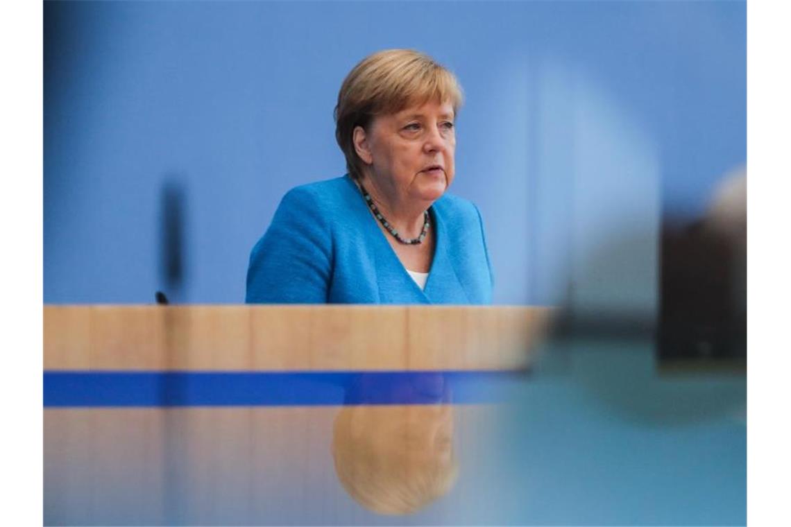 Bundeskanzlerin Angela Merkel (CDU) spricht in der Bundespressekonferenz während ihrer traditionellen Sommer-Pressekonferenz zu aktuellen innen- und außenpolitischen Themen. Foto: Christoph Soeder/dpa-Pool/dpa
