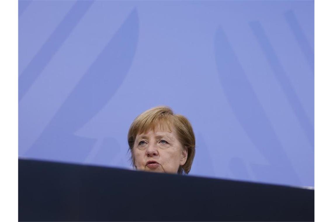 Bundeskanzlerin Angela Merkel spricht in der Pressekonferenz. Foto: Odd Andersen/AFP/dpa