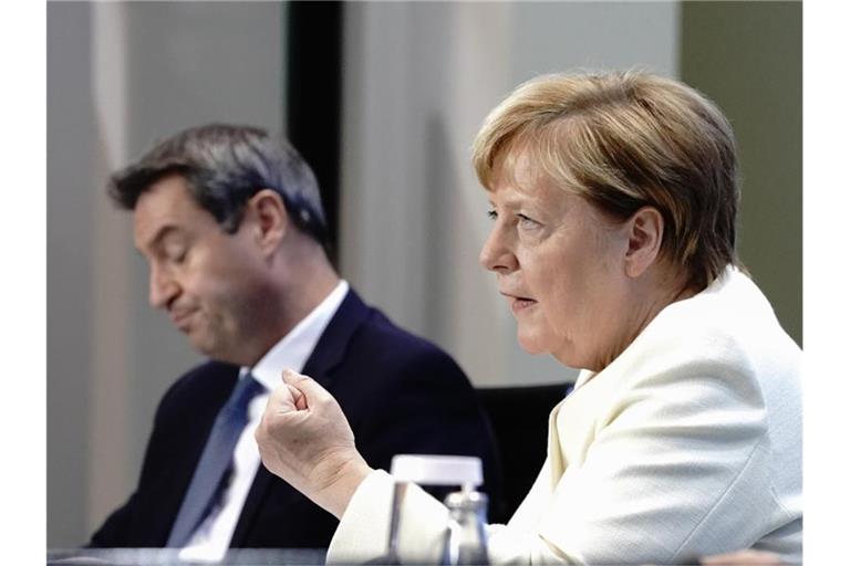 Bundeskanzlerin Angela Merkel und Bayerns Ministerpräsident Markus Söder. Foto: Kay Nietfeld/dpa