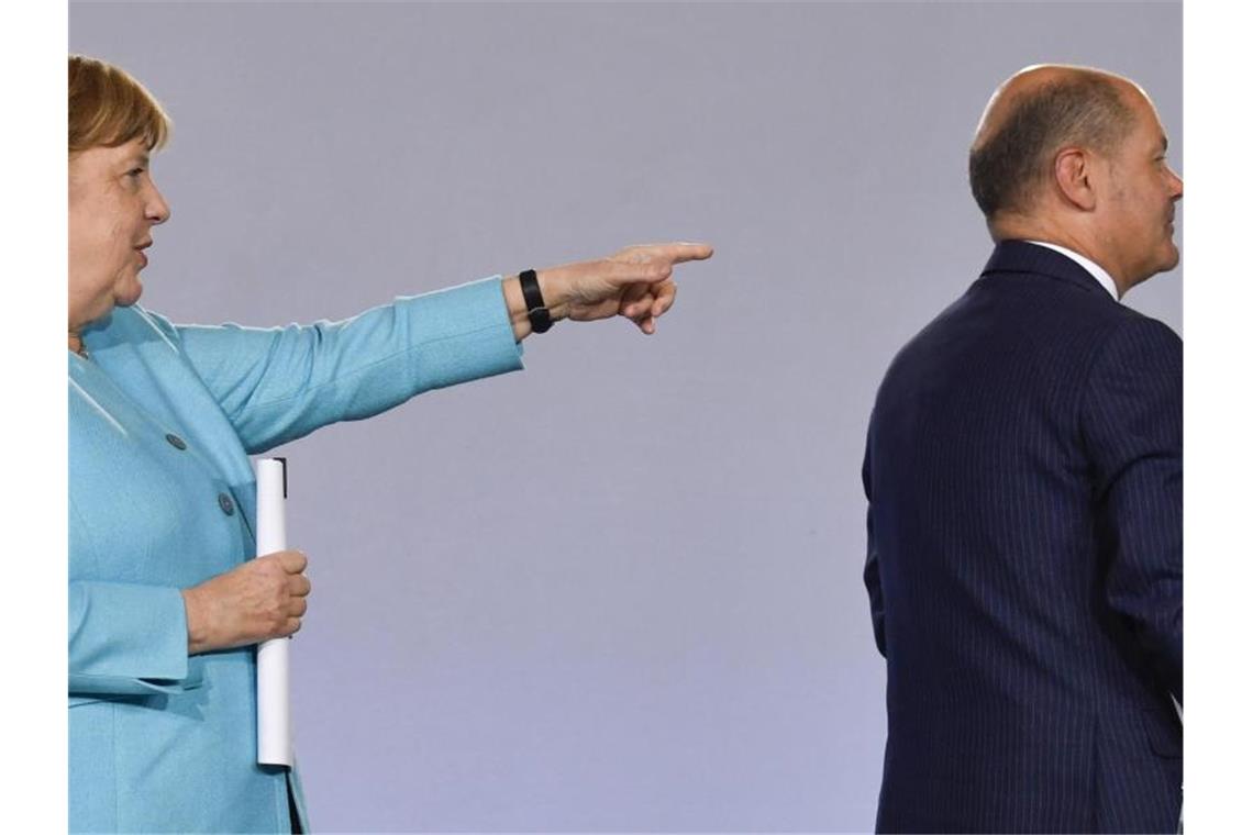 Bundeskanzlerin Angela Merkel und Finanzminister Olaf Scholz. Foto: John Macdougall/AFP/POOL/dpa