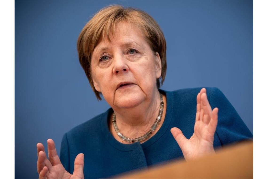 Bundeskanzlerin Angela Merkel: „Wir sind ... am Anfang einer Entwicklung, die wir noch nicht genau voraussehen können.“. Foto: Michael Kappeler/dpa
