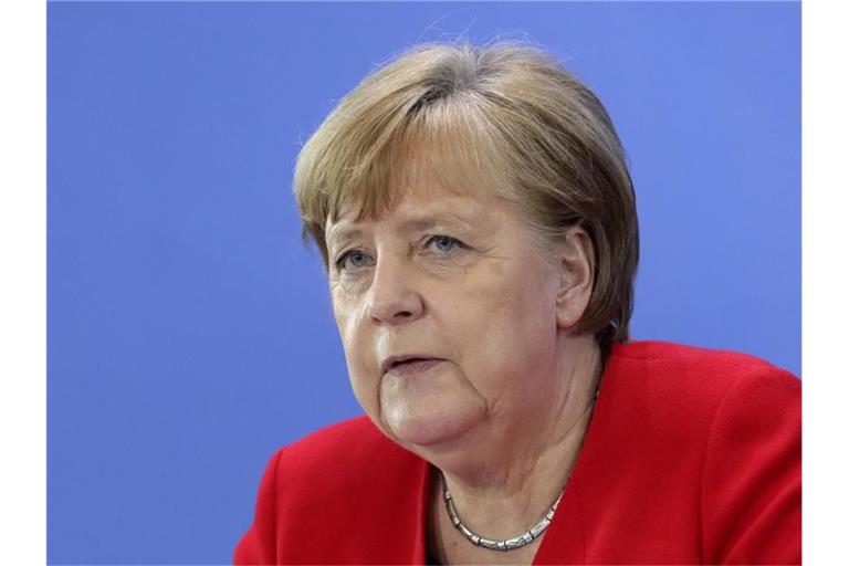Bundeskanzlerin Angela Merkel: Abstand, Mundschutz tragen und aufeinander Rücksicht nehmen. Foto: Michael Sohn/AP/POOL/dpa