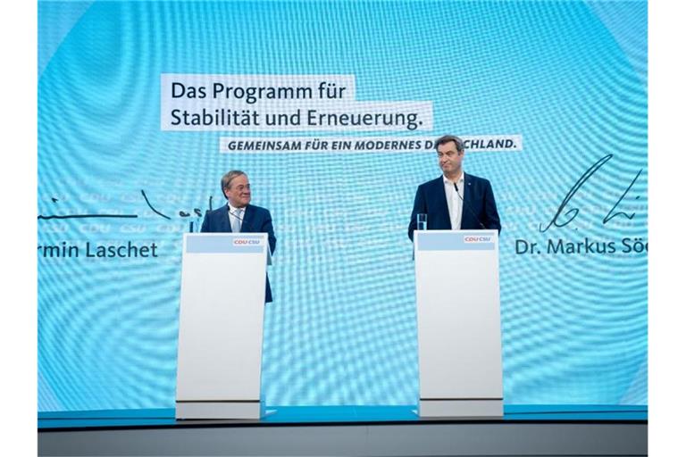 CDU-Chef Armin Laschet und CSU-Chef Markus Söder stellen das Programm für die Bundestagswahl vor. Foto: Kay Nietfeld/dpa