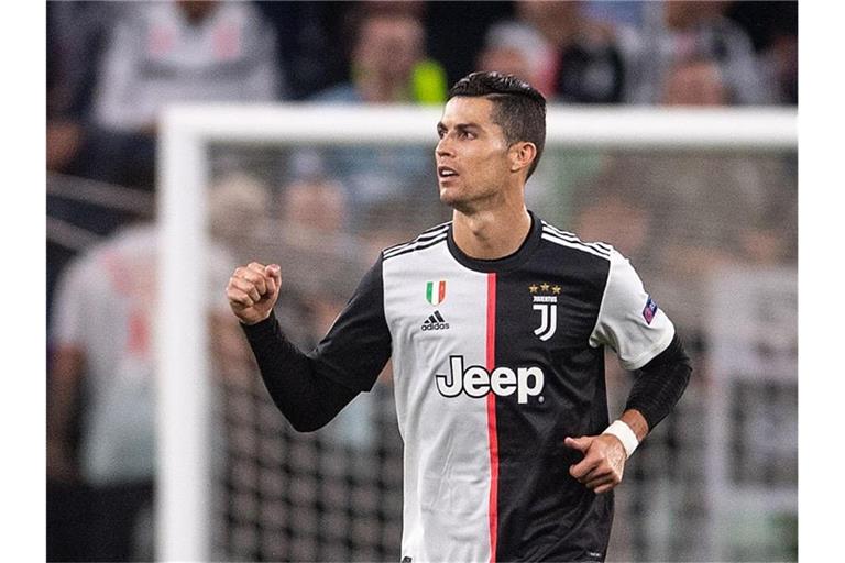 Christiano Ronaldo jubelt nach seinem Treffer zum 3:0 für Juve im Spiel gegen Bayer Leverkusen. Foto: Marius Becker/dpa