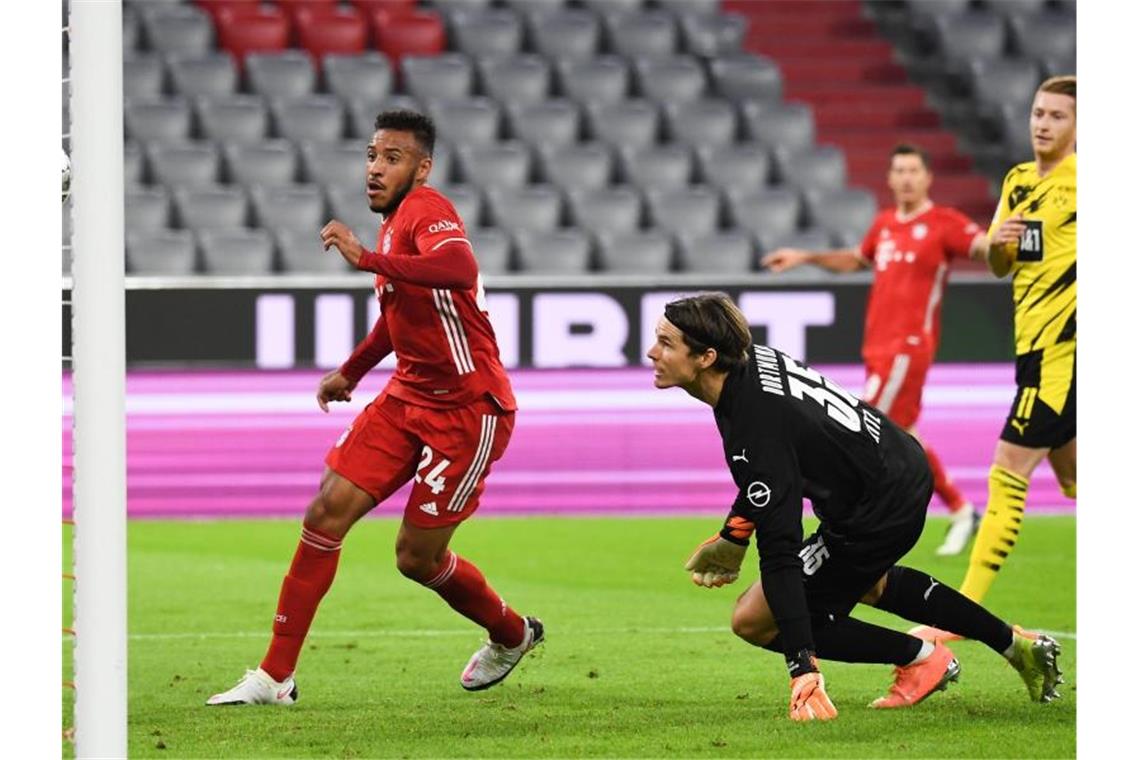 Corentin Tolisso von München (l) brachte die Bayern in Führung. Foto: Sven Hoppe/dpa-Pool/dpa