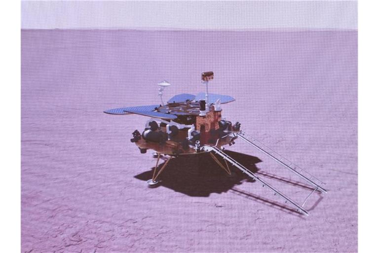 Das grafisch simulierte Bild zeigt die Landung der chinesischen Sonde auf dem Mars. Foto: Jin Liwang/XinHua/dpa