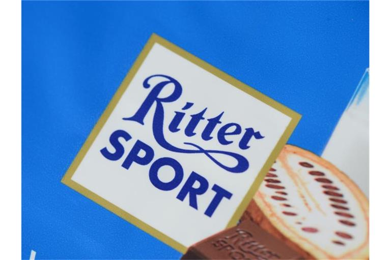 Das Logo der Marke Ritter-Sport-Schokolade ist zu sehen. Foto: picture alliance / dpa/Archivbild