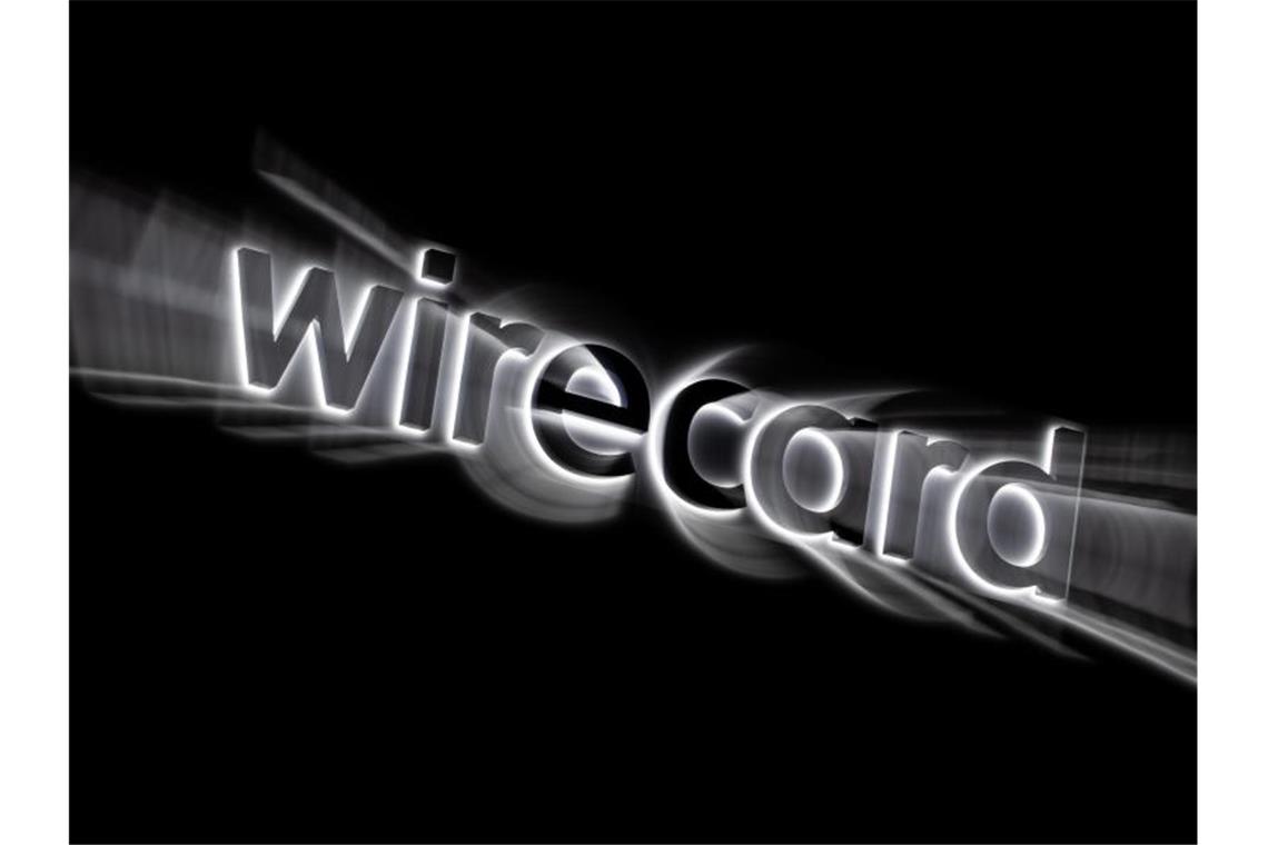 „Staatsversagen“? Der politische Fall Wirecard fängt erst an Das Logo von Wirecard an der Fassade des Firmensitzes in Aschheim bei München. Foto: Peter Kneffel/dpa