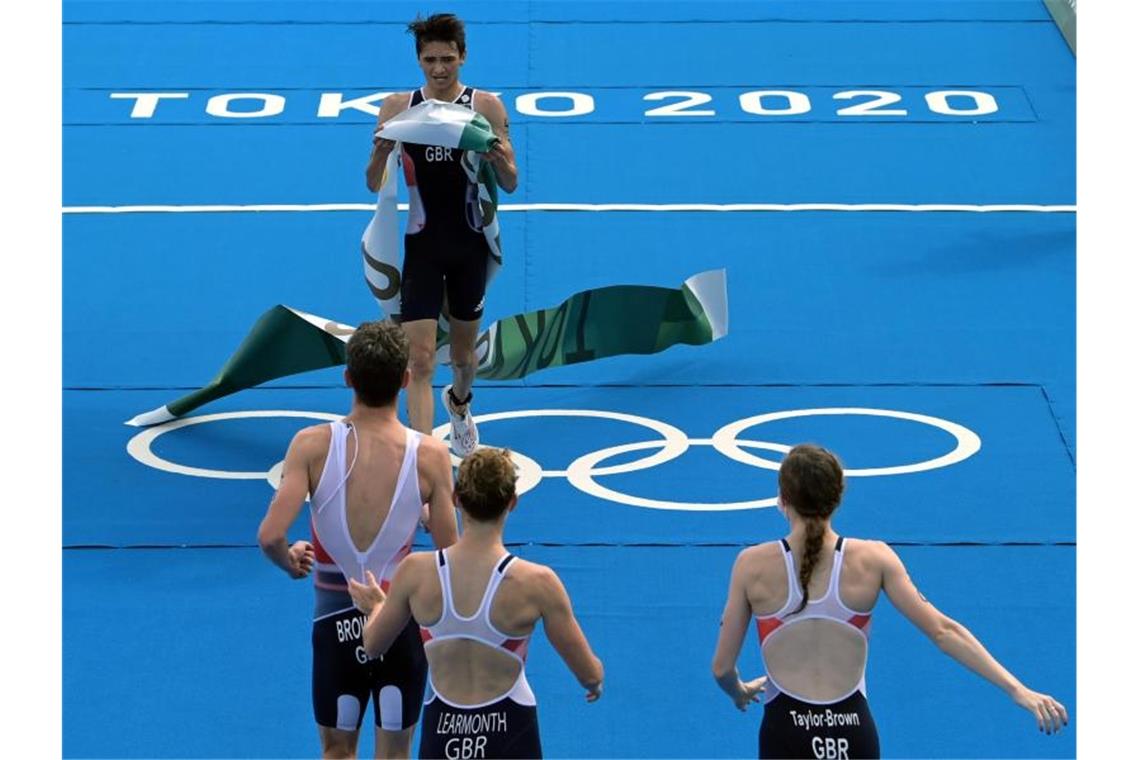 Das war die Olympia-Nacht Das Triathlon-Team aus Großbritannien gewann Gold. Foto: Sebastian Gollnow/dpa