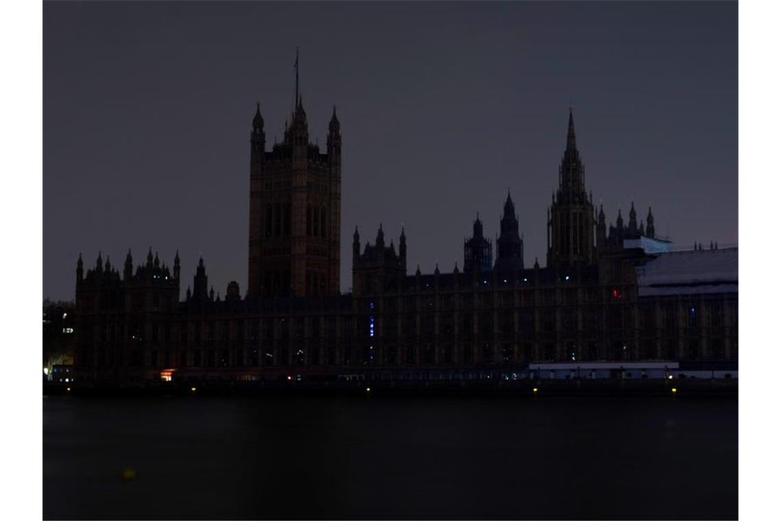 Der abgedunkelte Londoner Palace of Westminster während der Earth Hour 2019. Foto: David Parry/PA Wire/dpa