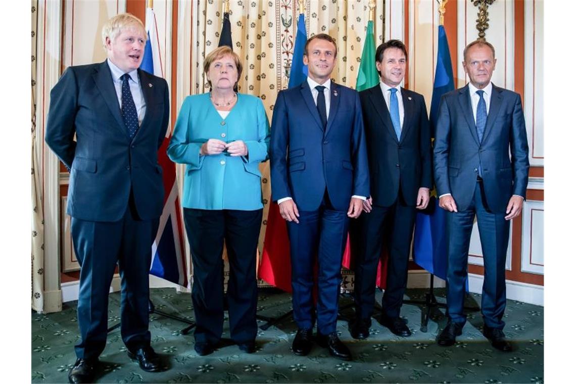 Der britische Premierminister Boris Johnson (l-r), Bundeskanzlerin Angela Merkel, Frankreichs Präsident Emmanuel Macron, der italienische Ministerpräsident Giuseppe Conte und EU-Ratspräsident Donald Tusk beim G7-Gipfel in Biarritz. Foto: Michael Kappeler