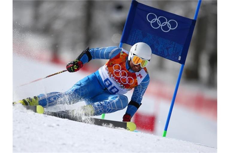 Der iranische Skirennfahrer Hossein Saveh Shemshaki fährt bei den Winterspielen in Sotschi 2014 die Piste herunter. Foto: picture alliance / dpa