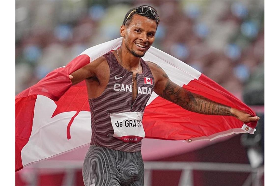 Der Kanadier Andre De Grasse jubelt im Ziel nach seinem Sieg über 200 Meter. Foto: Michael Kappeler/dpa