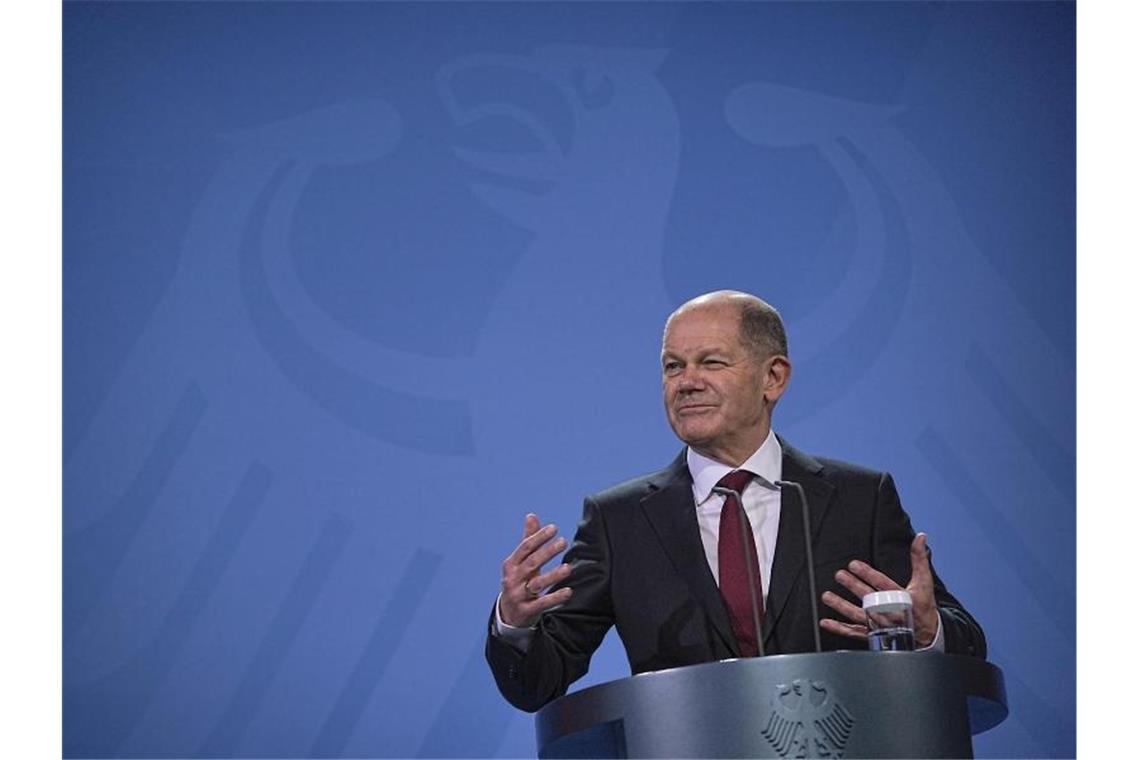 Der neue Bundeskanzler Olaf Scholz bei seiner Amtsübergabe. Foto: Michael Kappeler/dpa