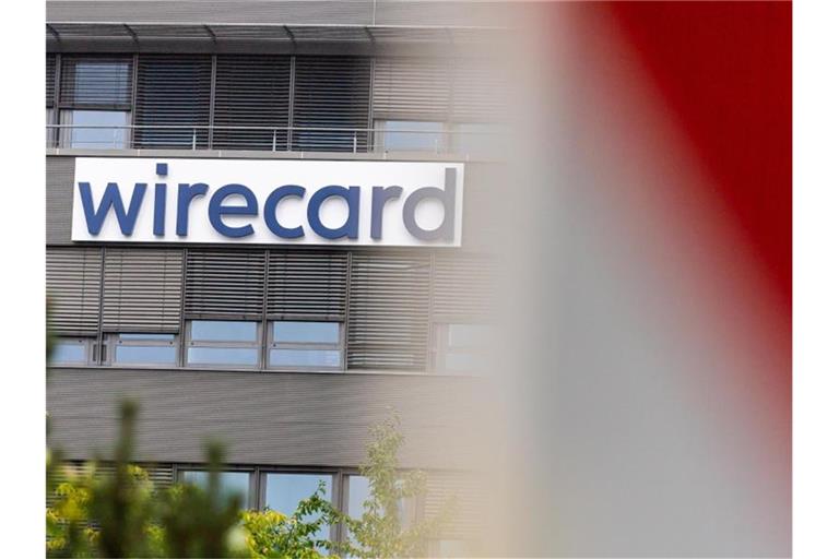 Der Schriftzug der insolventen Firma Wirecard an der Fassade des Unternehmens in Aschheim bei München. Foto: Peter Kneffel/dpa