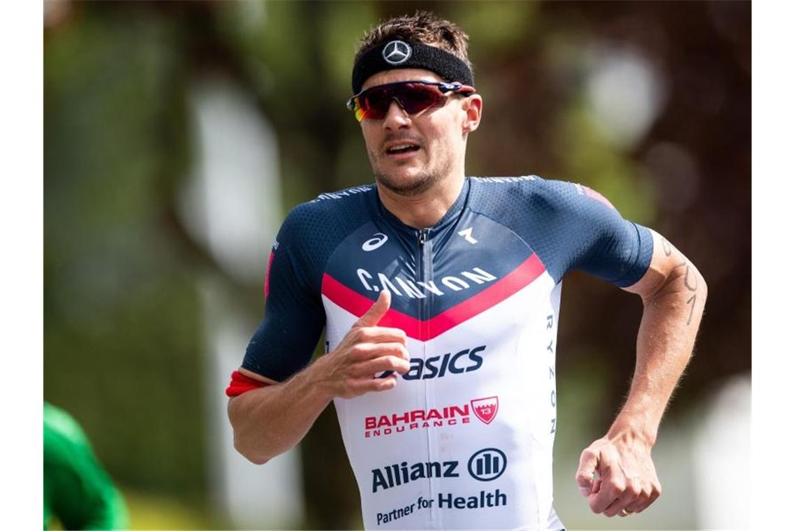 Frodeno will Kraichgau-Sieg wiederholen: Kienle in Samorin Der spätere Erstplatzierte Jan Frodeno läuft beim Triathlon Buschhütten. Foto: Marius Becker/Archivbild