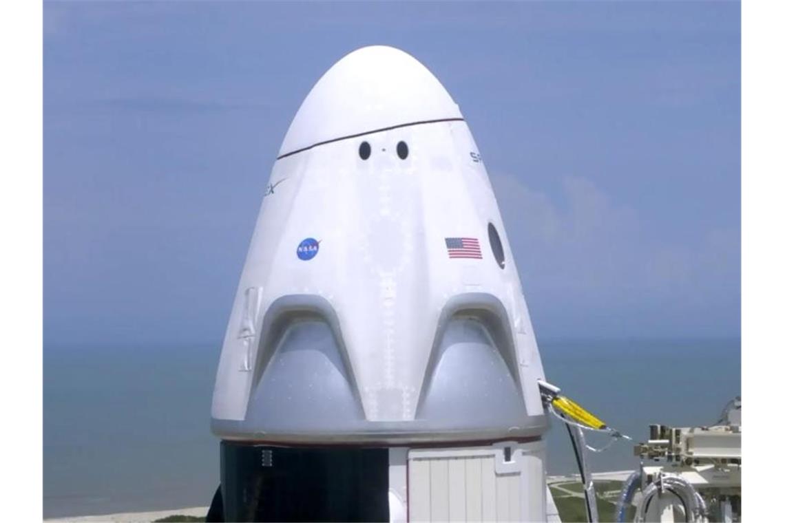 Die Besatzungskapsel der Dragon kurz vor dem Start in einer Nahaufnahme. Foto: Uncredited/NASA TV/AP/dpa