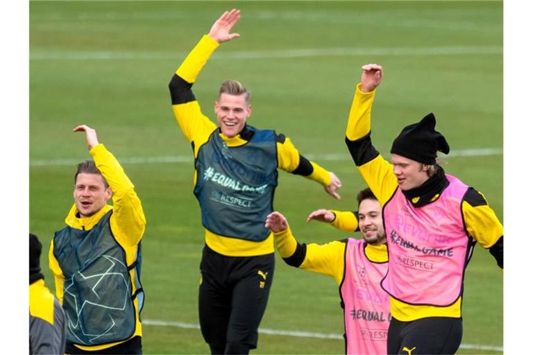 Die BVB-Profis um Lukasz Piszczek, Steffen Tigges, Raphael Guerreiro und Erling Haaland (l-r) wollen Manchester City die Sensation schaffen. Foto: Bernd Thissen/dpa
