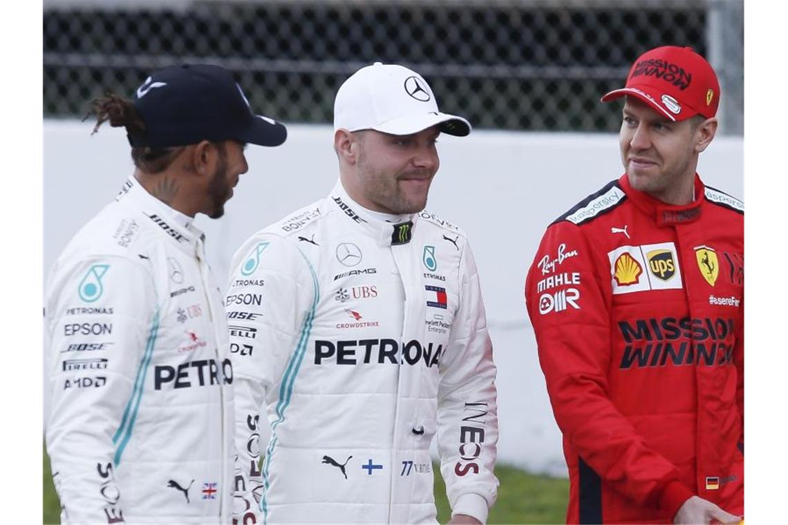Die Stars der Formel 1: Die Mercedes-Fahrer Lewis Hamilton (l) und Valtteri Bottas (M) sowie Ferarri-Pilot Sebastian Vettel. Foto: Eric Alonso/ZUMA Wire/dpa