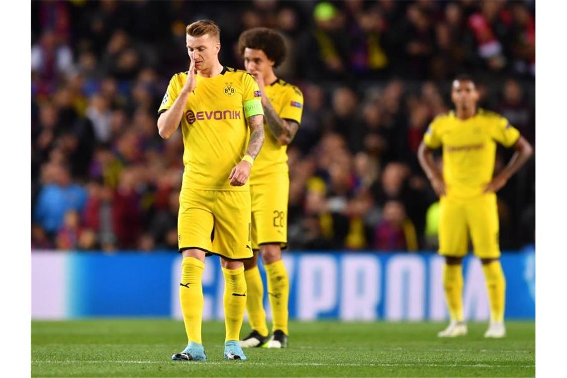 Dortmunds Spieler reagieren auf den 0:2-Rückstand. Foto: Marius Becker/dpa
