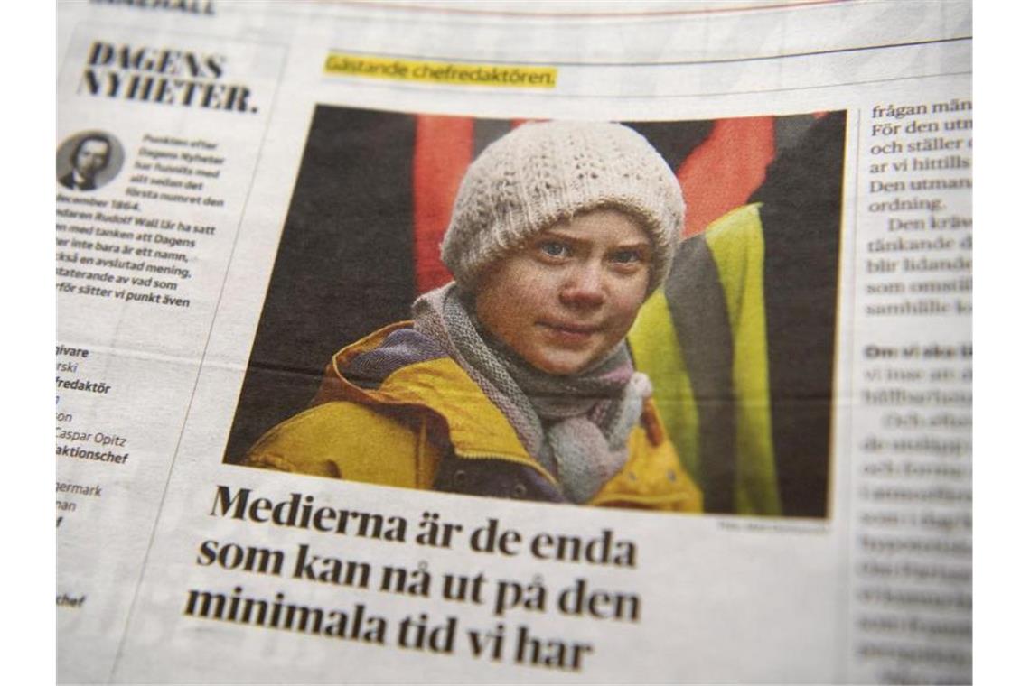 Greta Thunberg als Chefredakteurin? Medien und das Klima Ein Foto von Klima-Aktivistin Greta Thunberg ziert eine Seite der schwedischen Tageszeitung "Dagens Nyheter". Foto: Henrik Montgomery/TT NEWS AGENCY/AP/dpa