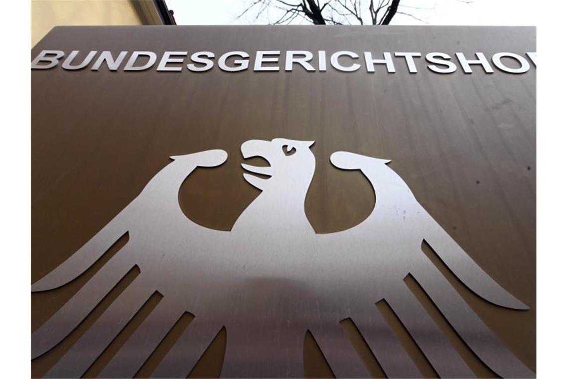 Ein Hinweisschild mit Bundesadler und dem Schriftzug „Bundesgerichtshof“. Foto: Uli Deck/dpa/Symbolbild