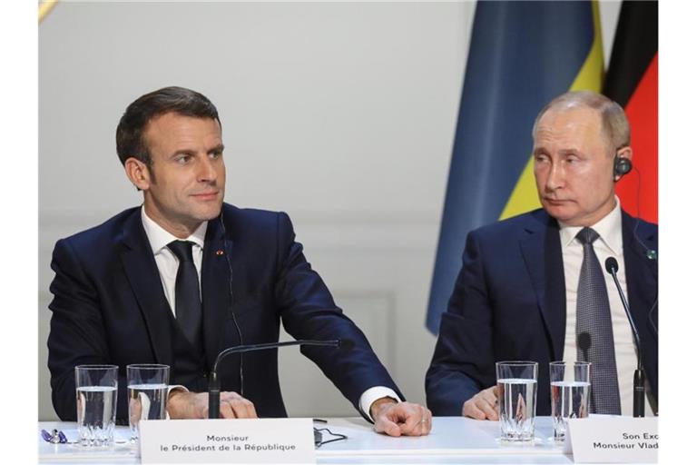 Emmanuel Macron (l) und Wladimir Putin bei einer gemeinsamen Pressekonferenz im Dezember 2019. Foto: Ludovic Marin/AFP Pool/AP/dpa