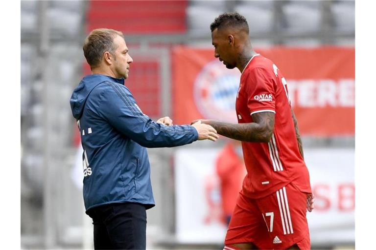 Erfolgs-Duo: Bayern-Coach Hansi Flick und Jérôme Boateng. Foto: Sven Hoppe/dpa-Pool/dpa