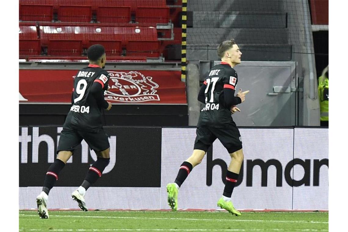 Florian Wirtz (r) schoss Leverkusen zum Heimsieg gegen den BVB. Foto: Martin Meissner/Pool AP/dpa