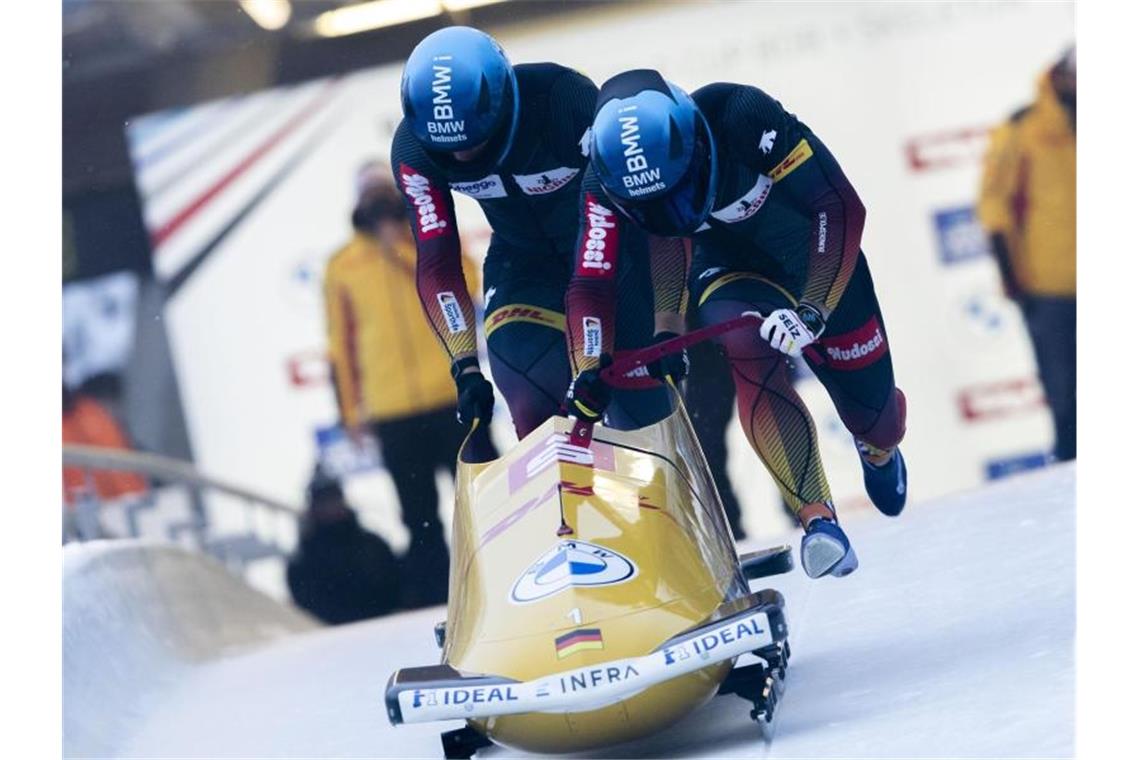 Francesco Friedrich und Thorsten Margis siegten im Eiskanal von Innsbruck. Foto: Lisa Leutner/AP/dpa