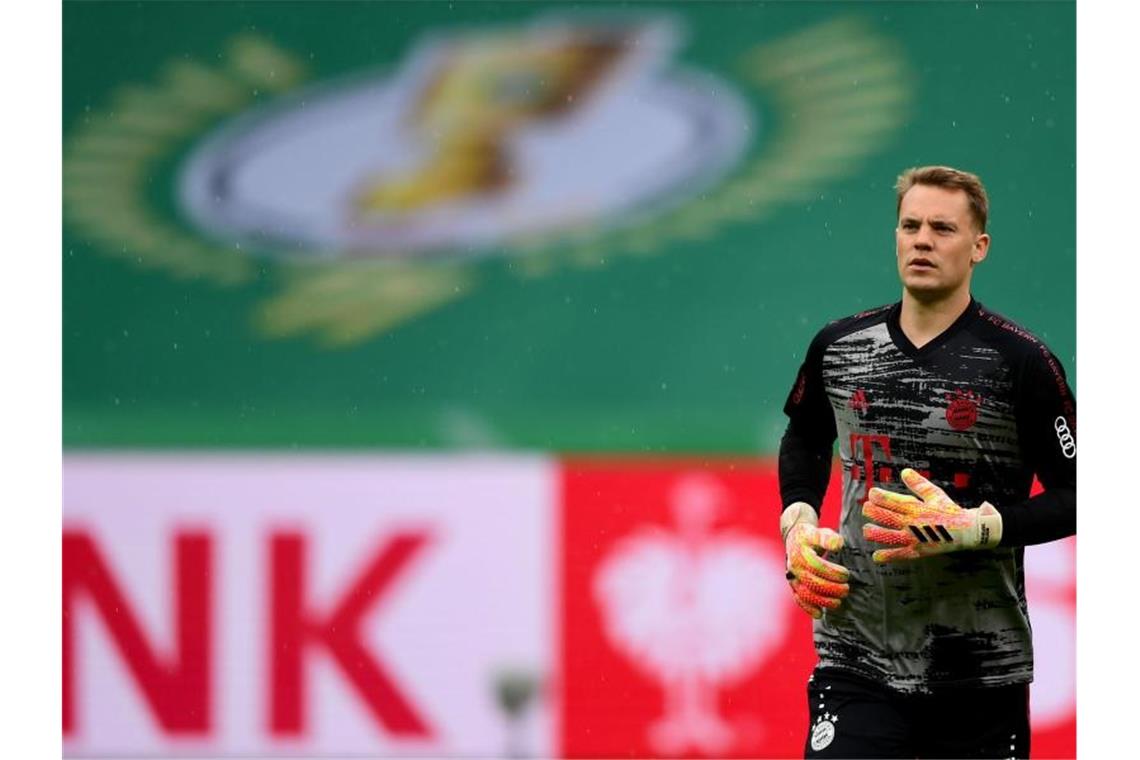 Führt den FC Bayern im Geister-Pokalfinale als Kapitän auf das Feld: Keeper Manuel Neuer. Foto: Robert Michael/dpa-Zentralbild/Pool/dpa