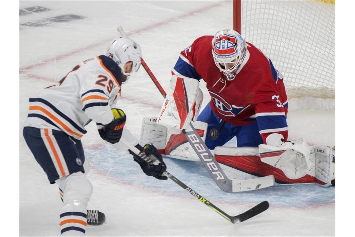 Zwei Tore von Draisaitl bei viertem Oilers-Sieg in Serie Für Leon Draisaitl (l) lief es gegen die Montreal Canadiens besonders gut. Foto: Graham Hughes/The Canadian Press via AP/dpa