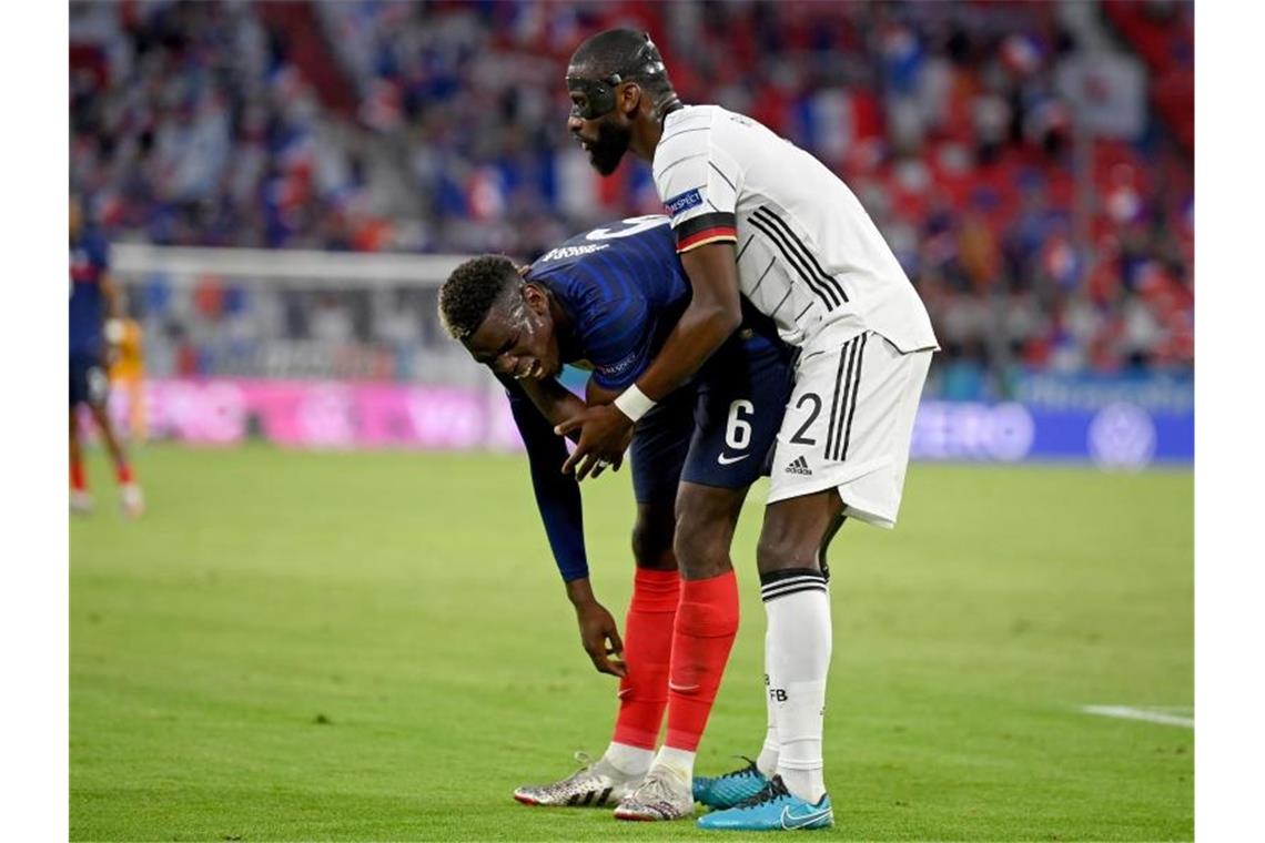 Gerieten in München kurz aneinander: Antonio Rüdiger (r) und Paul Pogba. Foto: Matthias Hangst/Getty Pool/AP/dpa