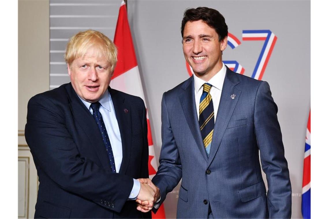 Großbritannien und Kanada haben in einem Videogespräch ein vorläufiges Handelsabkommen unterzeichnet. Foto: Jeff J Mitchell/PA Wire/dpa