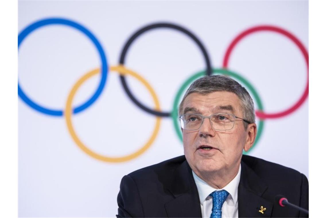 hält das Festhalten an der planmäßigen Austragung der Olympischen Spiele für gerechtfertigt: IOC-Chef Thomas Bach. Foto: Jean-Christophe Bott/KEYSTONE/dpa