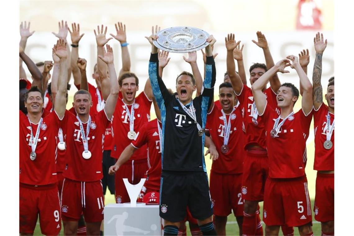 Holte sich zum achten Mal nacheinander die Meisterschaft in der Bundesliga: FC Bayern München. Foto: Kai Pfaffenbach/Reuters-Pool/dpa
