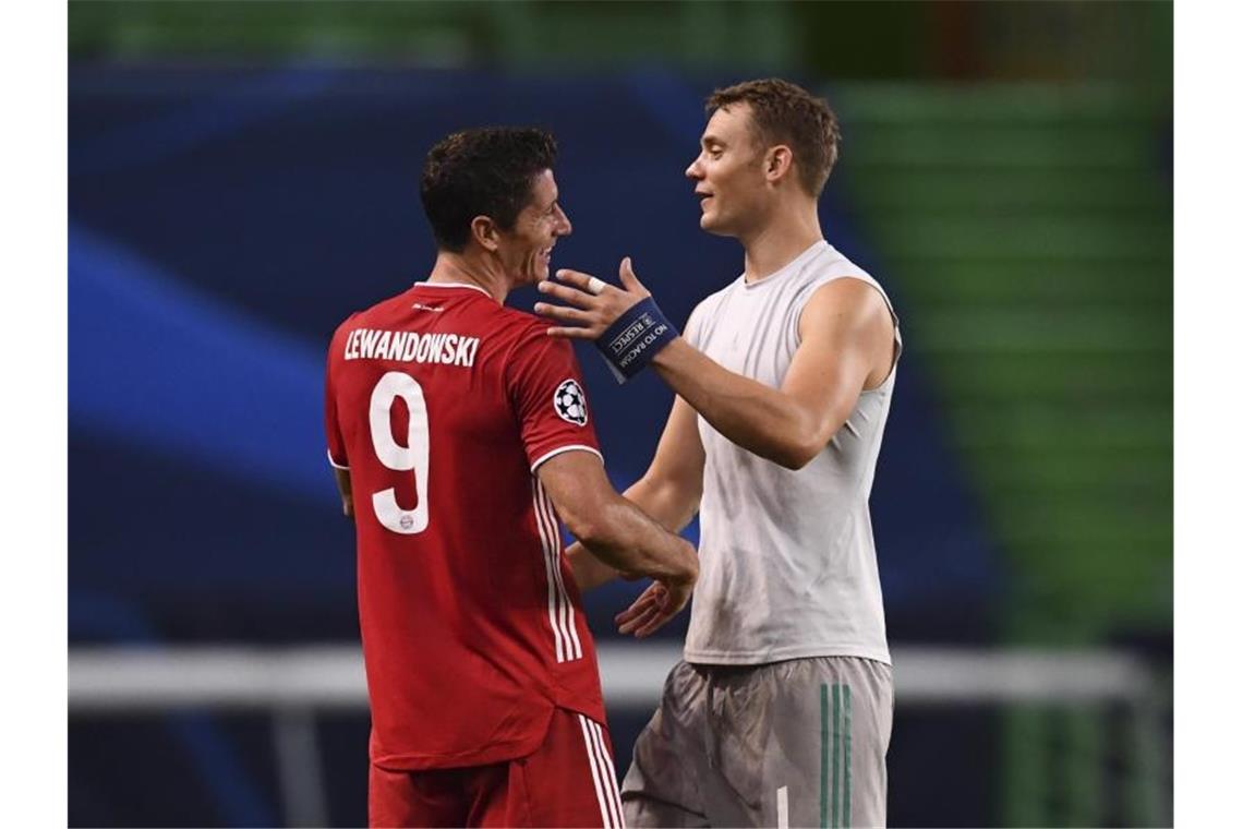 Holten mit Bayern das Triple: Torjäger Robert Lewandowski (l) und Torhüter Manuel Neuer. Foto: Franck Fife/pool AFP/AP/dpa