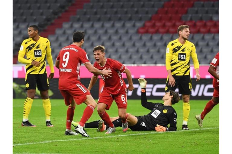 Joshua Kimmich (M) sorgte für den Bayern-Siegtreffer im Supercup gegen den BVB. Foto: Sven Hoppe/dpa-Pool/dpa