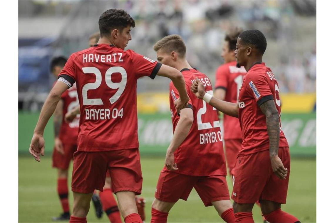 Kai Havertz (l) präsentiert sich derzeit in Bestform. Foto: Ina Fassbender/AFP-Pool/dpa